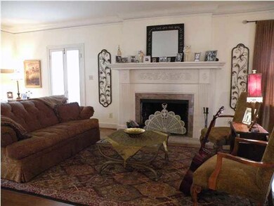 Formal living room has room for more than one seat