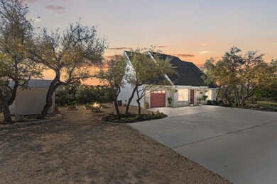 View of front of home featuring roof with shingle