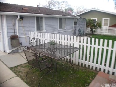 Back view of front unit; with fenced back yard.