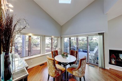 Dining Area Opens to Deck, Kitchen and Living Room