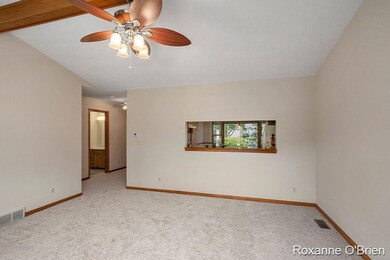 Living Room with Kitchen Pass Thru Windo