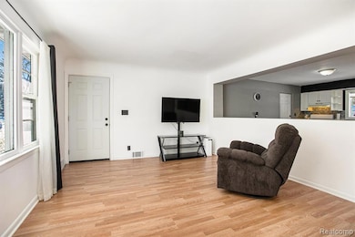 Sitting room with light wood-style flooring
