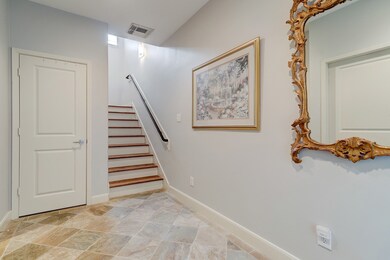 The large formal entry features neutral finishes a