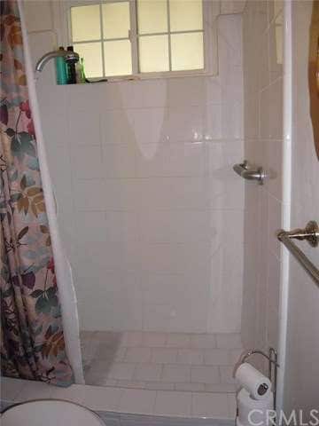 shower in master bath with newer ceramic tile