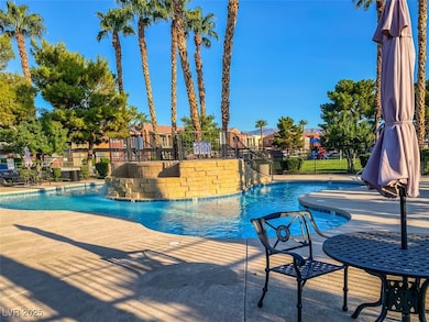 Community pool featuring seating area