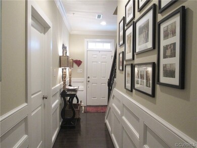 View of foyer from rear at garage door entry.