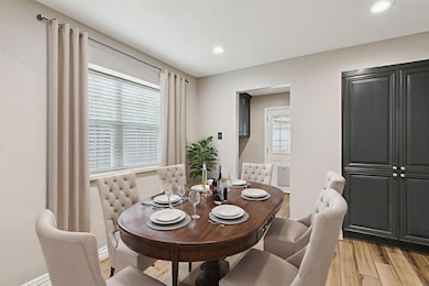 Bright and inviting, this spacious breakfast area that opens to the kitchen is the perfect spot for casual dining, morning coffee and gathering with loved ones.
