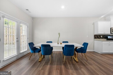 Dining area open to kitchen and living room.