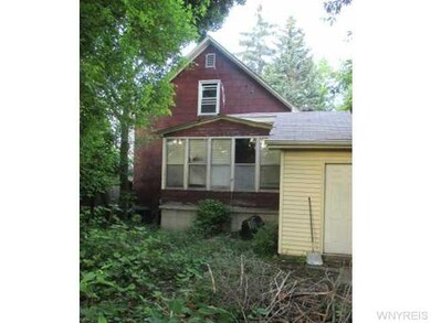 Exterior Back. 13x6 enclosed sun porch.