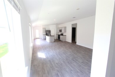 Living, dining, and kitchen area