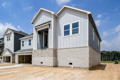 The light-colored vertical siding and contrasting