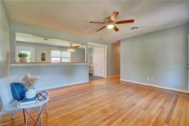 Living Room looking into bar and spacious eat-in kitchen