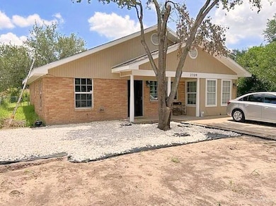 View of front of house with brick siding