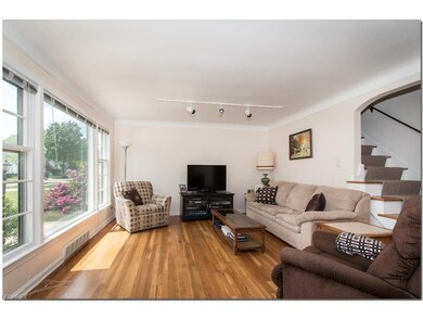 Spacious Living Room with Gleaming Hardwood Floors
