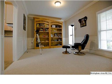 TO THE RIGHT AS YOU ENTER THROUGH THE FOYER IS THE