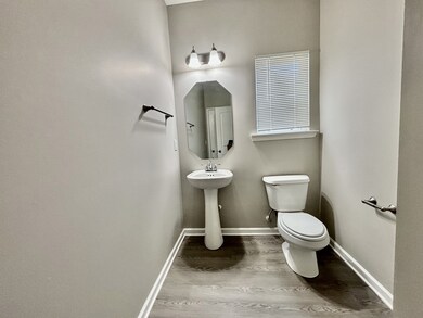 The half bath downstairs is by a Office or Rec Room. Could be used as a bedroom if needed (no closet)