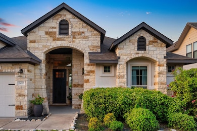 Entrance to property featuring a shingled roof, s