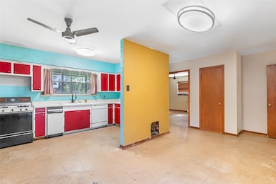 Dining area with view into kitchen.
