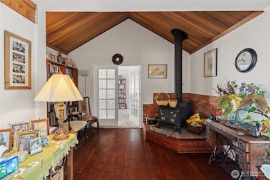 Vaulted ceilings leading to the main level primary bedroom through the french doors