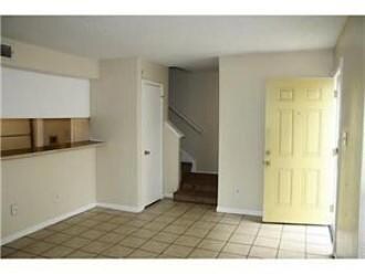 Kitchen with tile patterned floors and baseboards