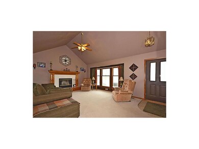 Large vaulted family room with lots of windows and