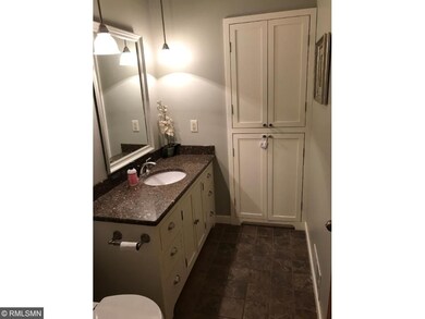 Main floor bath with tile floor, custom-built vani