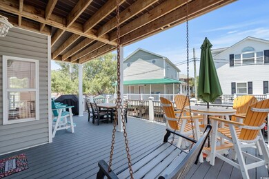 Wooden terrace with outdoor dining area and grilling area