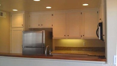 View of kitchen through the convenient pass-thru.