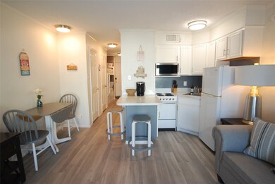 Kitchen and dining area is open to living space.