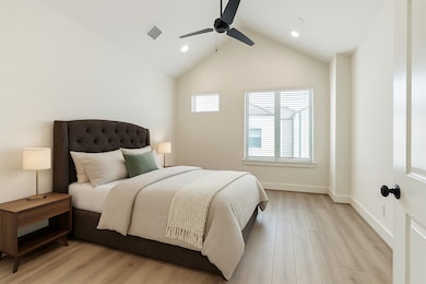Primary suite complete with high ceilings and a ce