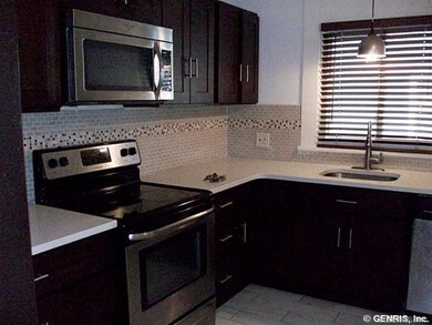 Kitchen. stainless steel appliances. new tile floo