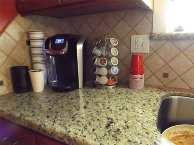 Kitchen granite countertops and tile backsplash