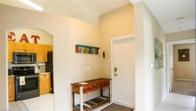 Kitchen featuring decorative backsplash, light til