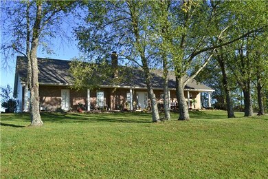 CUSTOM BUILT PARTIAL BRICK HOME ON JUST OVER 5 ACRES WITH OPEN FLOOR PLAN!  OVERSIZED  2 CAR ATTACHED GARAGE WITH 2 PEDESTRIAN DOORS....  25x21! 