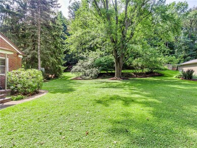 Side yard looking to the backyard. This home butts