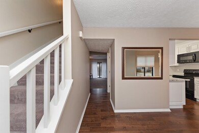 As you step into the home, you will note the beautiful flooring leading to the living and throughout the kitchen and breakfast room.