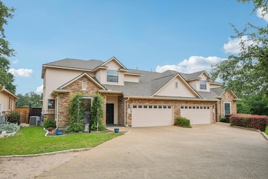 View of front of house with driveway, an attached