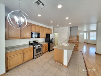 Kitchen featuring stainless steel appliances, a ch
