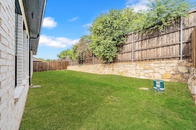 View of fenced backyard