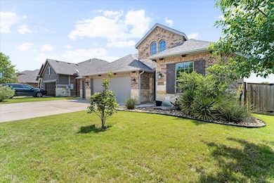 View of front of property with driveway, fence, a
