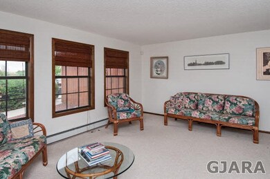 The roomy living rooms faces the street, yet still