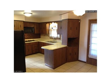 Open to the dining area is the kitchen, which feat