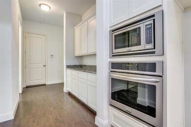 Adjacent additional storage cabinets and work spac