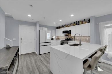 Kitchen with stainless steel appliances, a sink, a