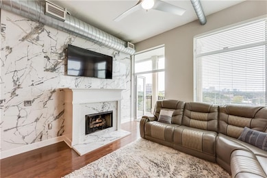 Living room with wood finished floors, baseboards,