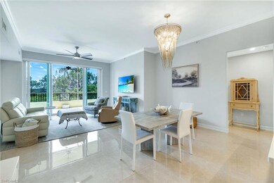 Great Room and Dining room featuring ornamental molding, a chandelier, ceiling fan, baseboards, and light tile patterned flooring