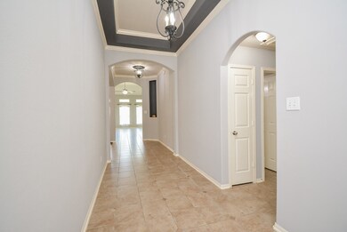 Gorgeous front entrance with high ceilings & custom chandeliers