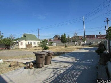 View of lot from SE corner. A few concrete pads