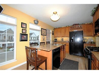 Eat-in kitchen with granite countertops and cerami