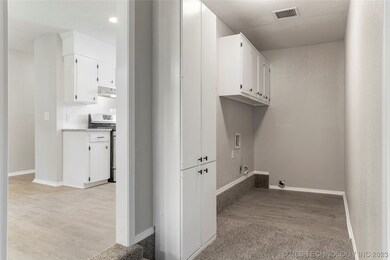 Indoor Utility room with 
storage is a great bonu